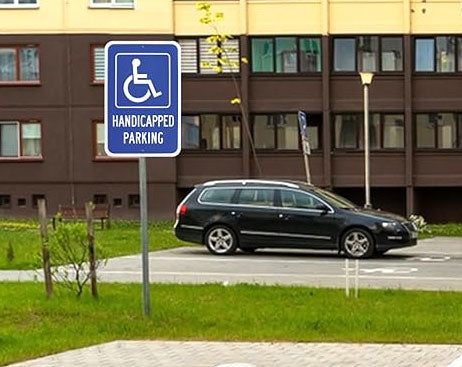 Do handicap signs need to say reserved parking?