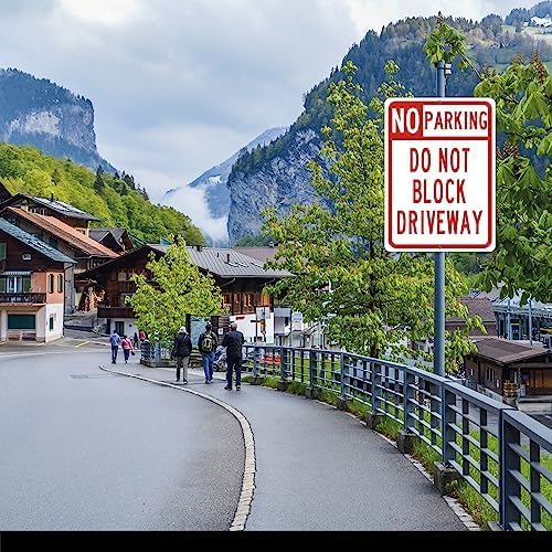 A rectangular no parking sign with a white background and red text that reads 'DO NOT BLOCK DRIVEWAY'.